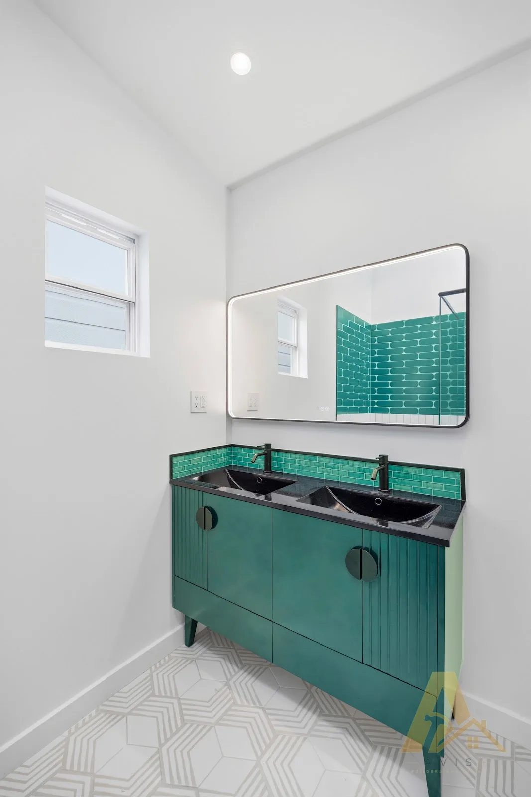 Teal fluted vanity with black basins and a rectangular mirror