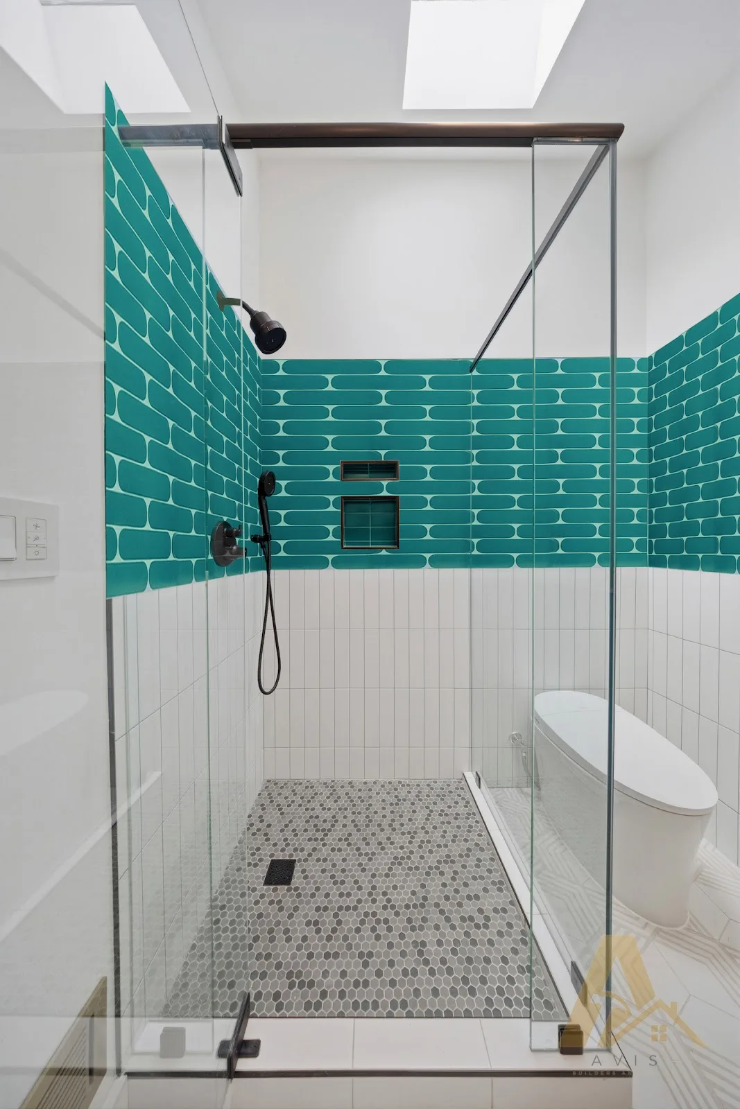 Teal tile bathroom shower with glass enclosure