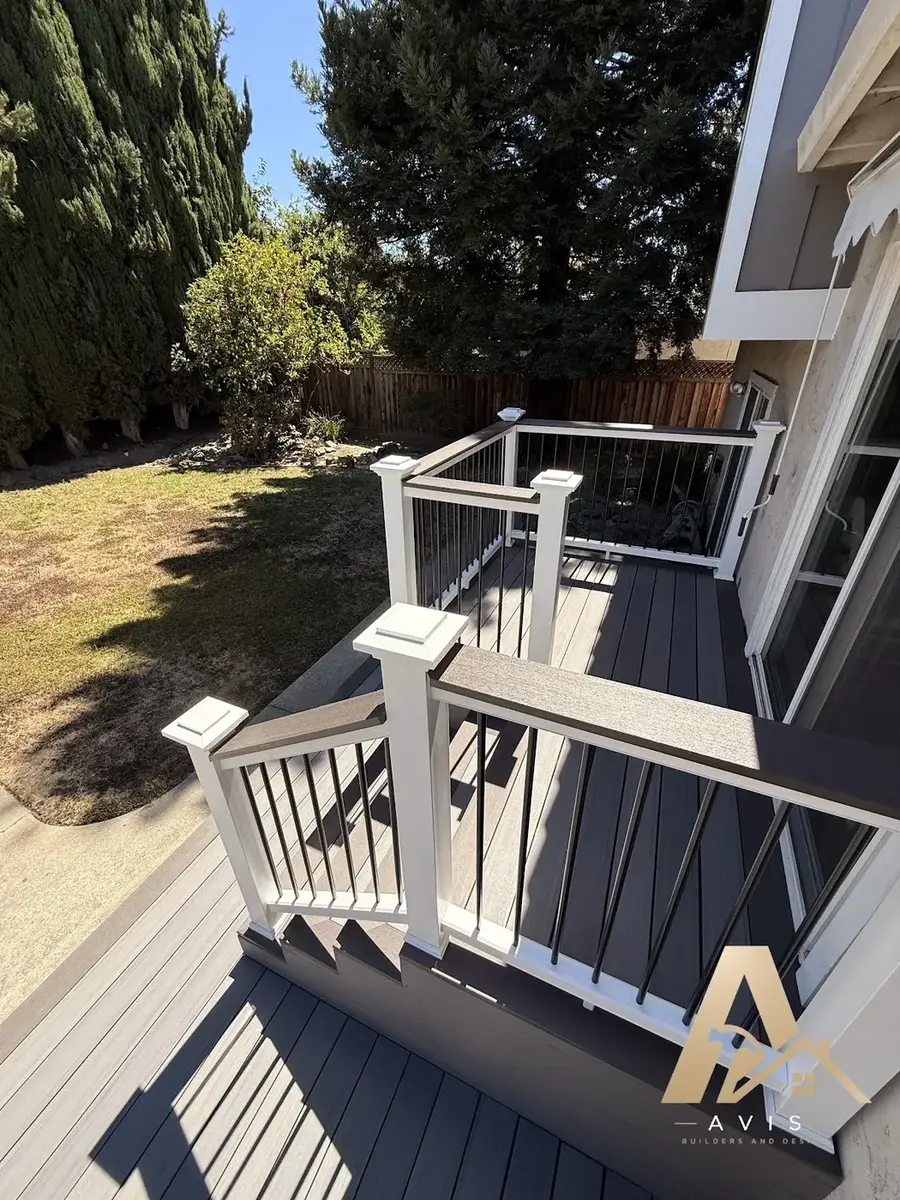 Composite deck steps leading down to a lawn