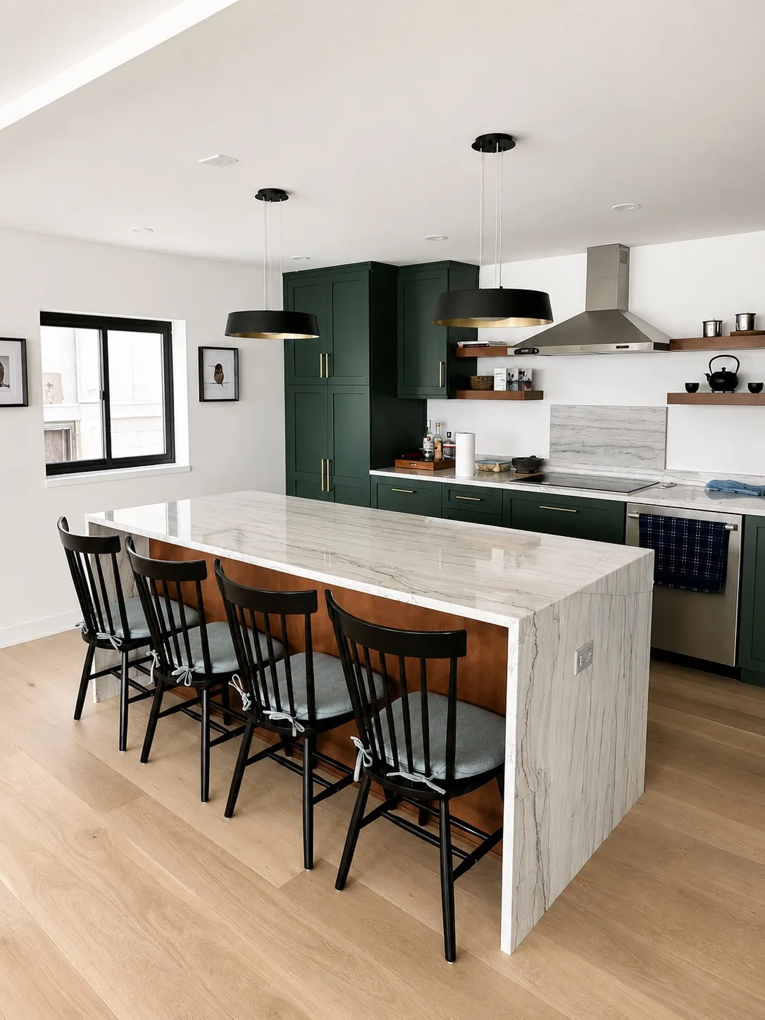Dark green kitchen with marble waterfall island