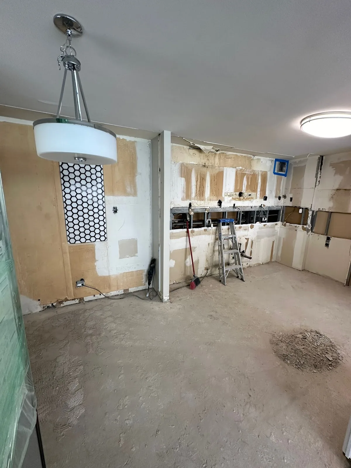 Interior demolition in progress with exposed studs